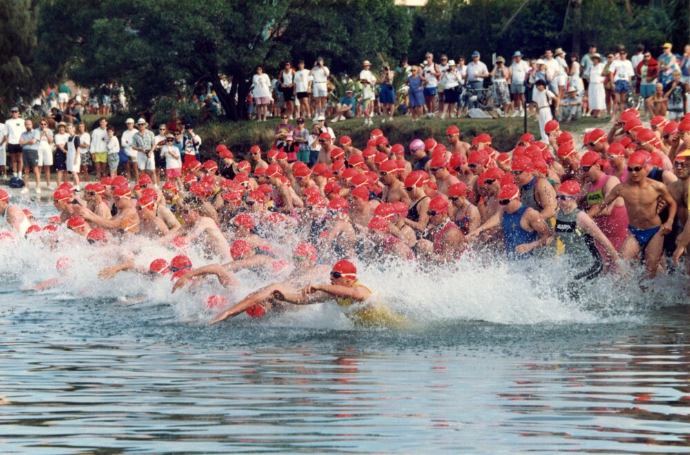 Competitors, swim leg, Noosa Triathlon, Noosa Heads, 1980s