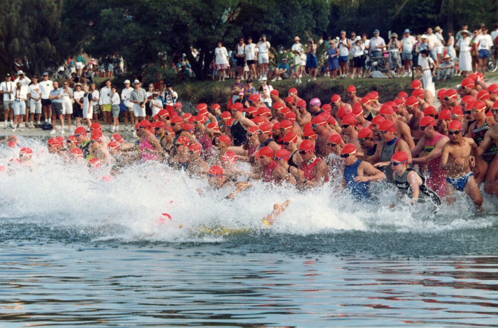 Competitors, swim leg, Noosa Triathlon, Noosa Heads, 1980s