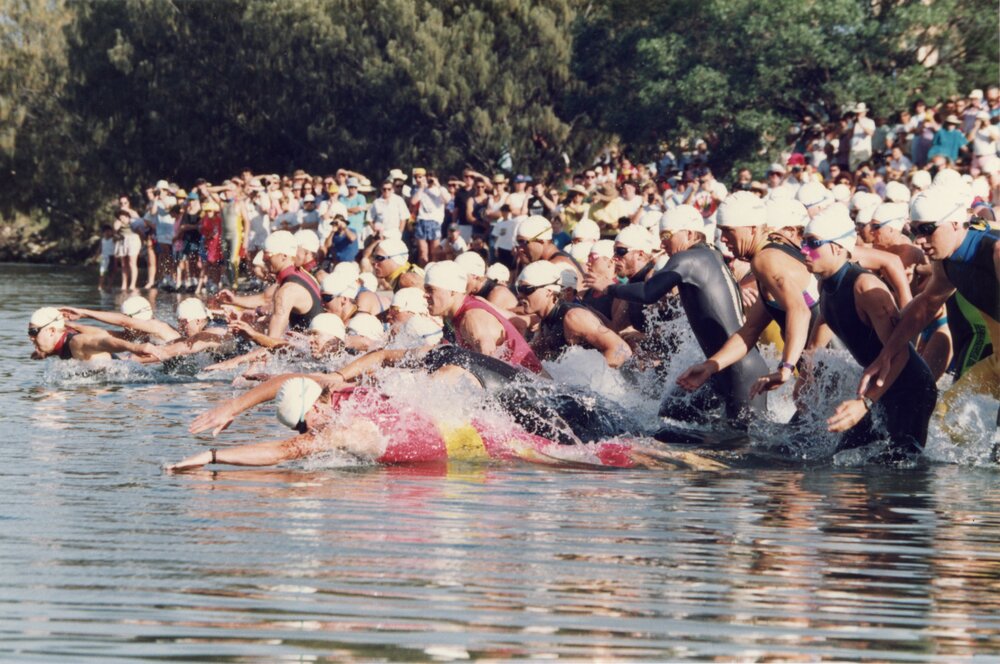 Competitors, swim leg, Noosa Triathlon, Noosa Heads, 1980s