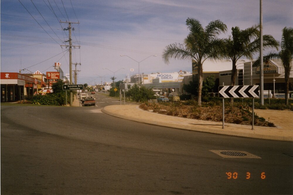 Businesses, round-a-bout, Noosa Drive and Sunsine Beach Road, Noosa Junction, Noosa Heads, 6 March 1990