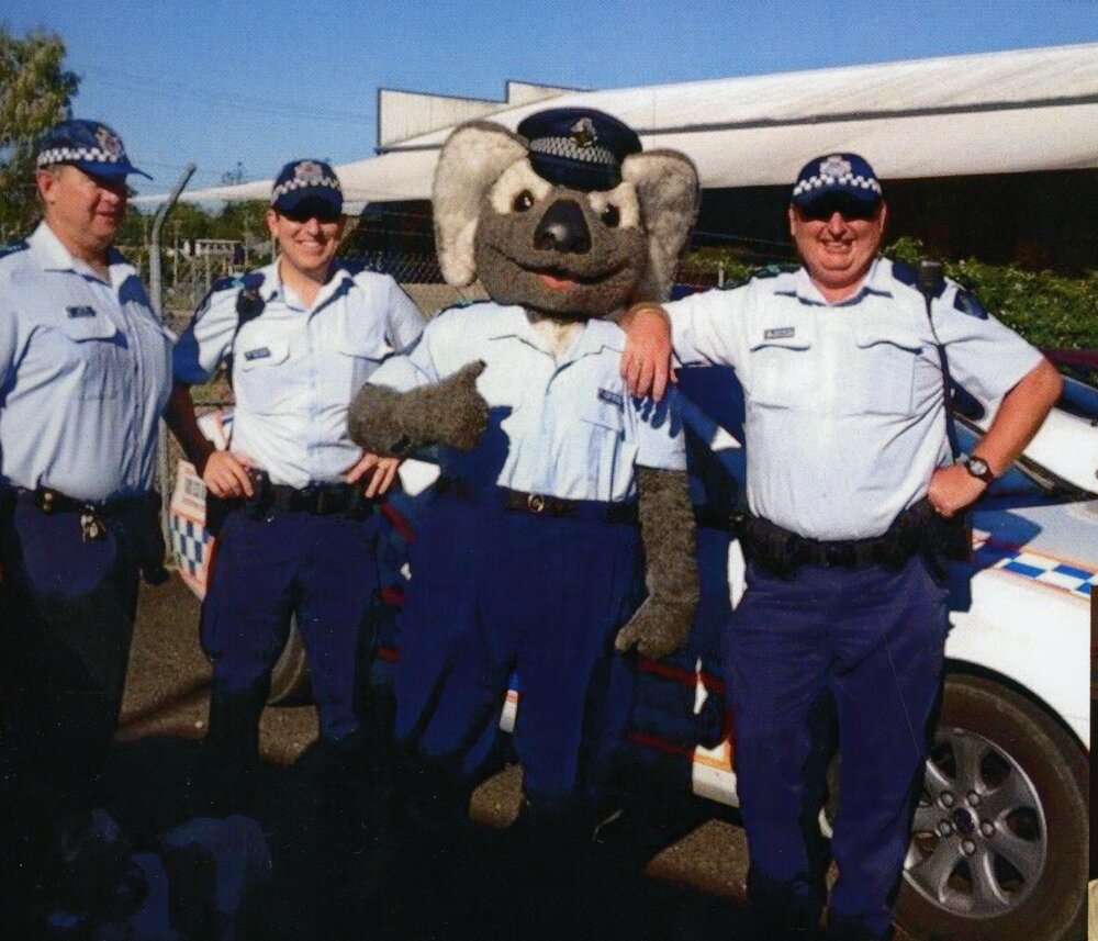 Sergeant Mal Scott, unknown officer, Senior Constable Clancy the Koala and unknown officer (l-r), Cooroy
