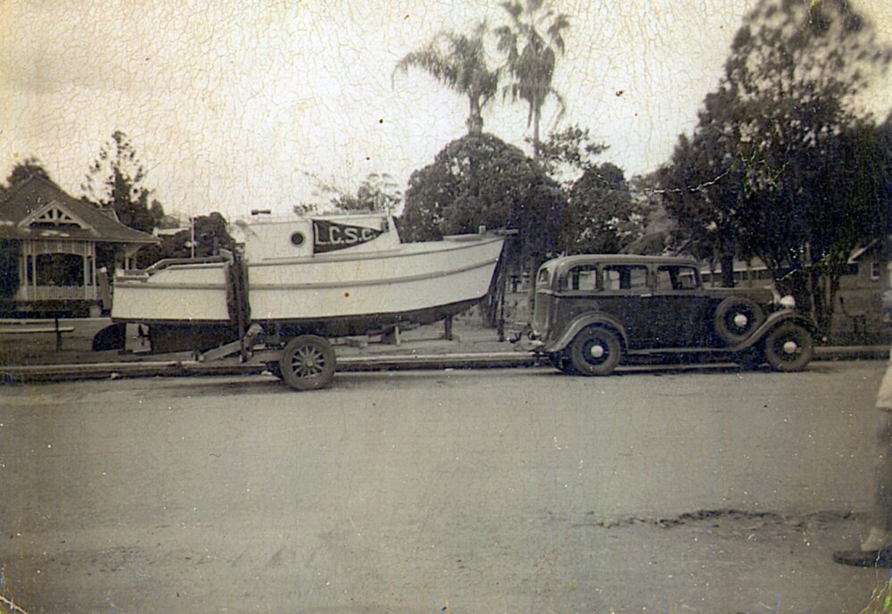 On the way, Lake Cootharaba Sailing Club boat, Reef Street, Gympie, 1950s