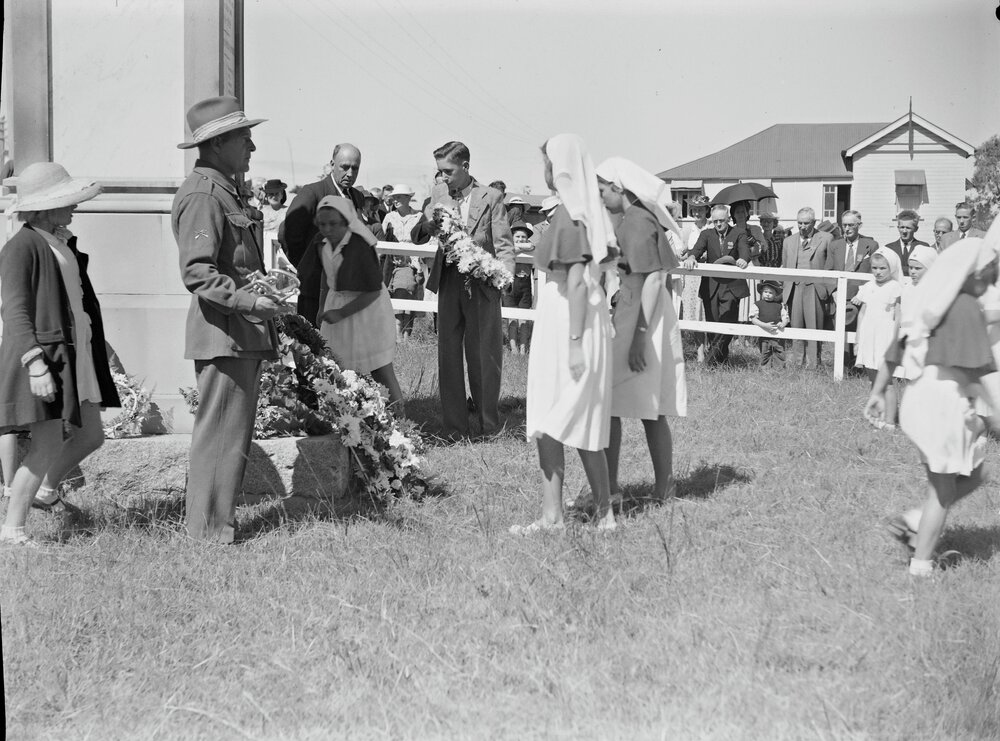 Wreath laying, Anzac Day, Cooroy War Memorial, Diamond Street, Cooroy, 25 April 1949