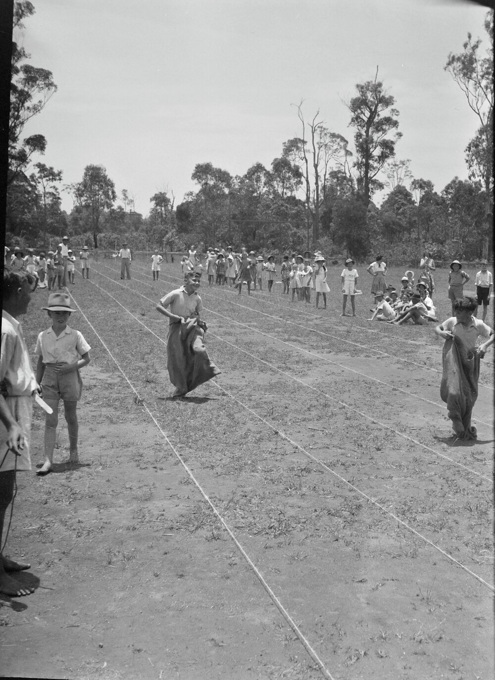 Sack race particpants, Sports Carnival, Cooroy State School, Cooroy, 1950