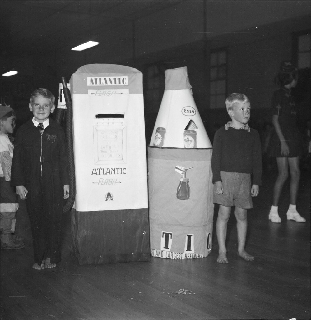 Petrol bowser &amp; oil bottle, Children's fancy dress ball, Tewantin, 1952