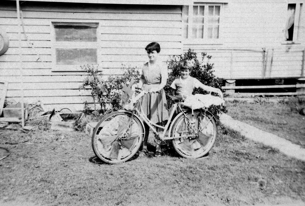 Decorated bicycle, Pat Wood and Joan Wood (l-r), Pine Street, Pomona ca 1950s