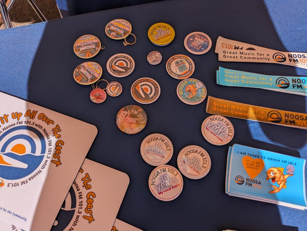 Give-aways, Noosa FM 101.3 tent, 'Celebrating Parkyn's Hut 25th Anniversary,' Tewantin, 13 June 2026