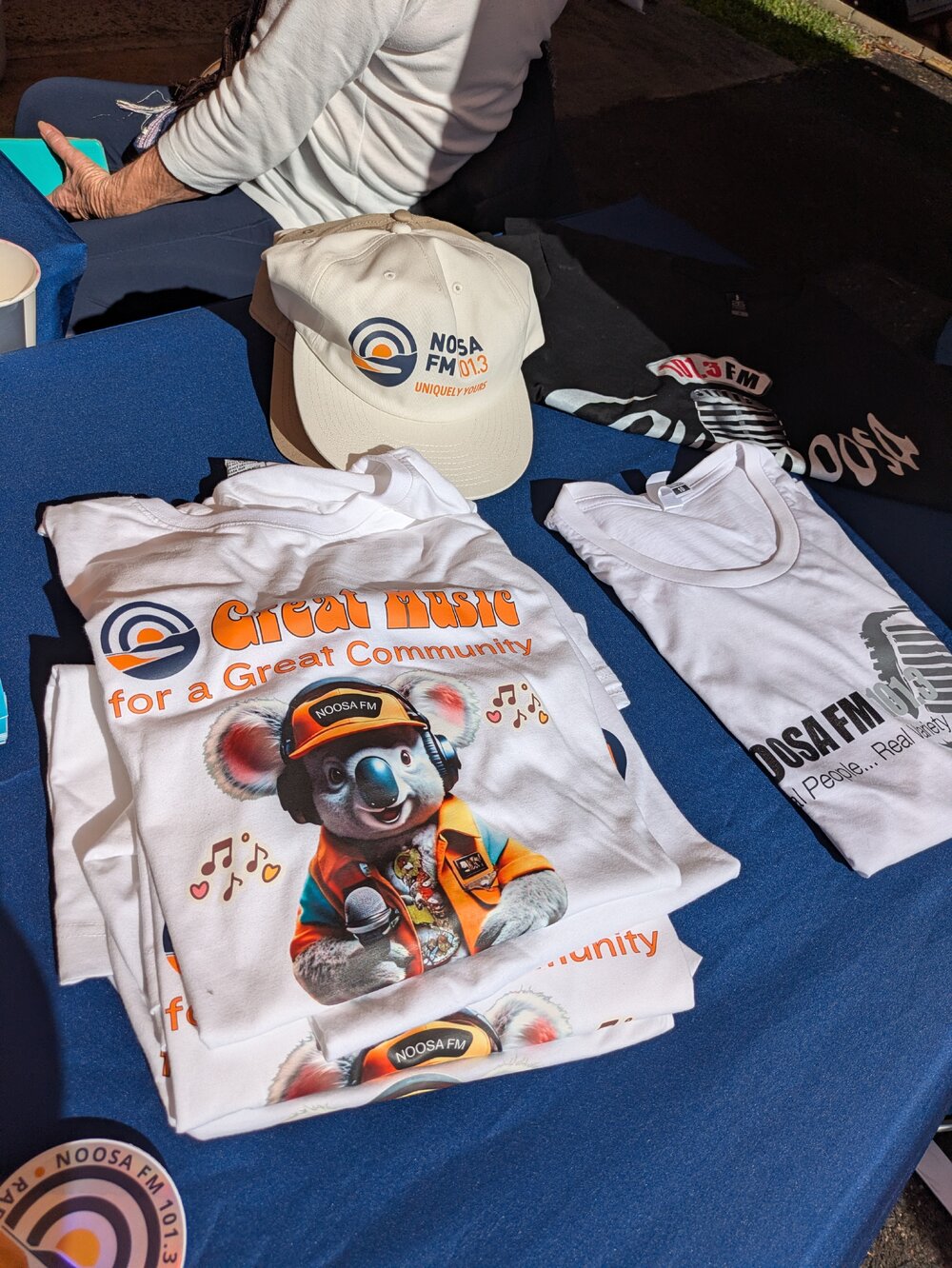 Give-aways, Noosa FM 101.3 tent, 'Celebrating Parkyn's Hut 25th Anniversary,' Tewantin, 13 June 2026
