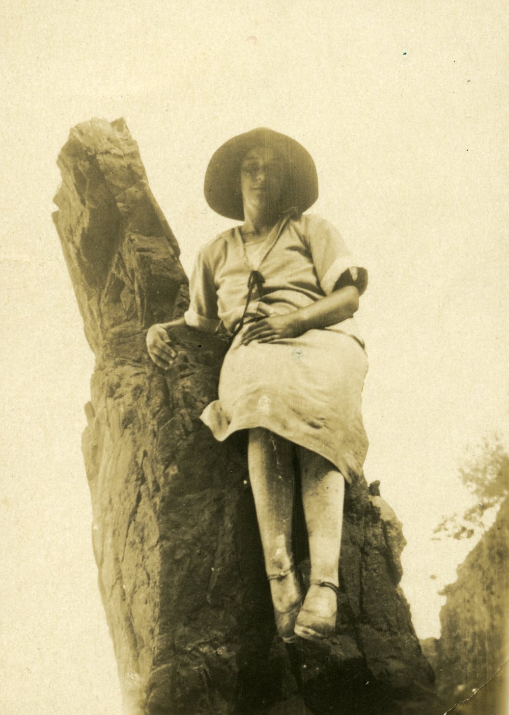 May Humphries seated on 'Cook's Monument', Monument Cove, Noosa National Park, Christmas 1925
