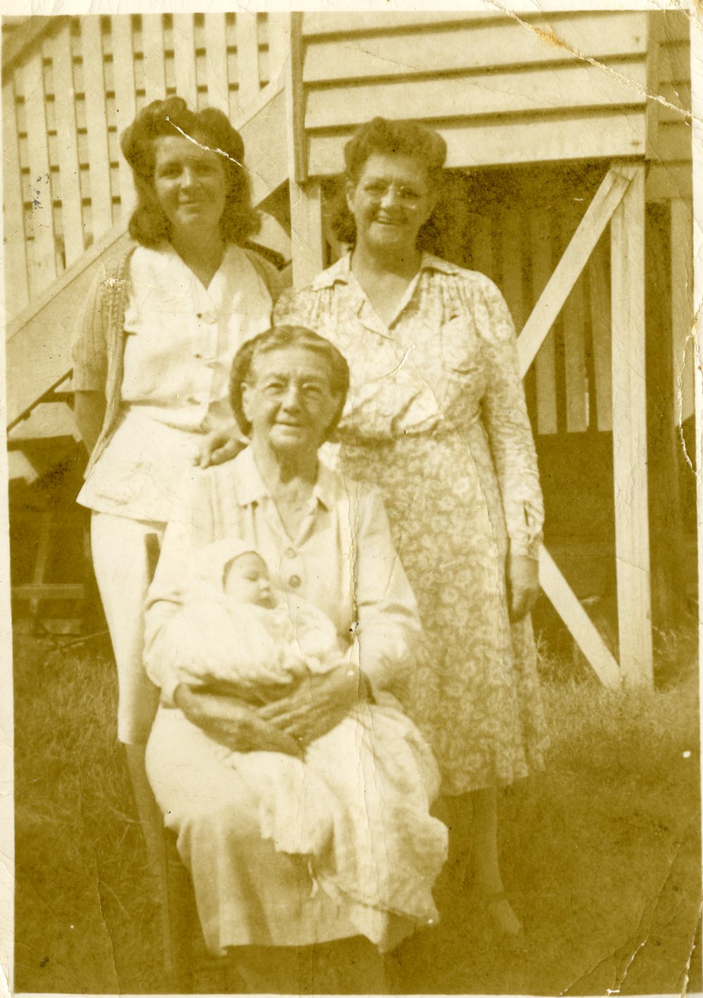 Rosie  Cobby, Dulcie Priddy, Martha Hay seated holding Denise Priddy