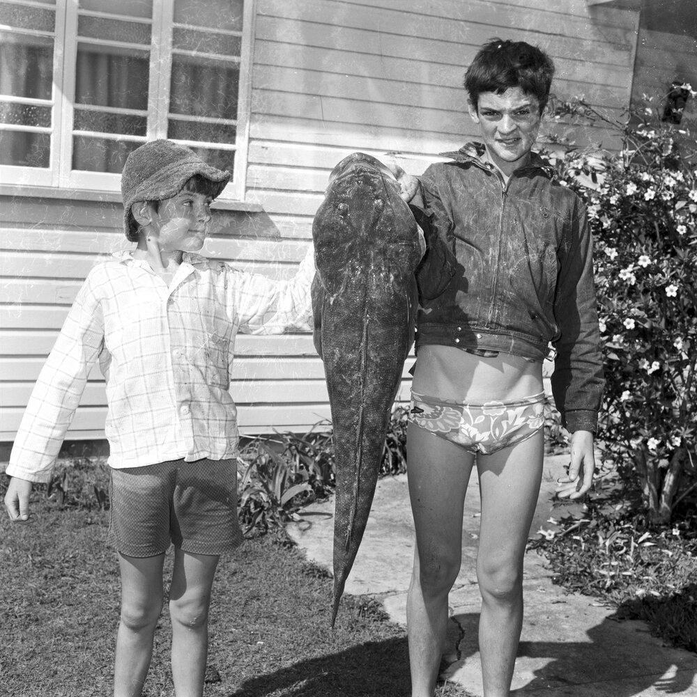 Paul and Brett Suttle,  with a 14lb 9oz flathead, Noosaville, October 1970