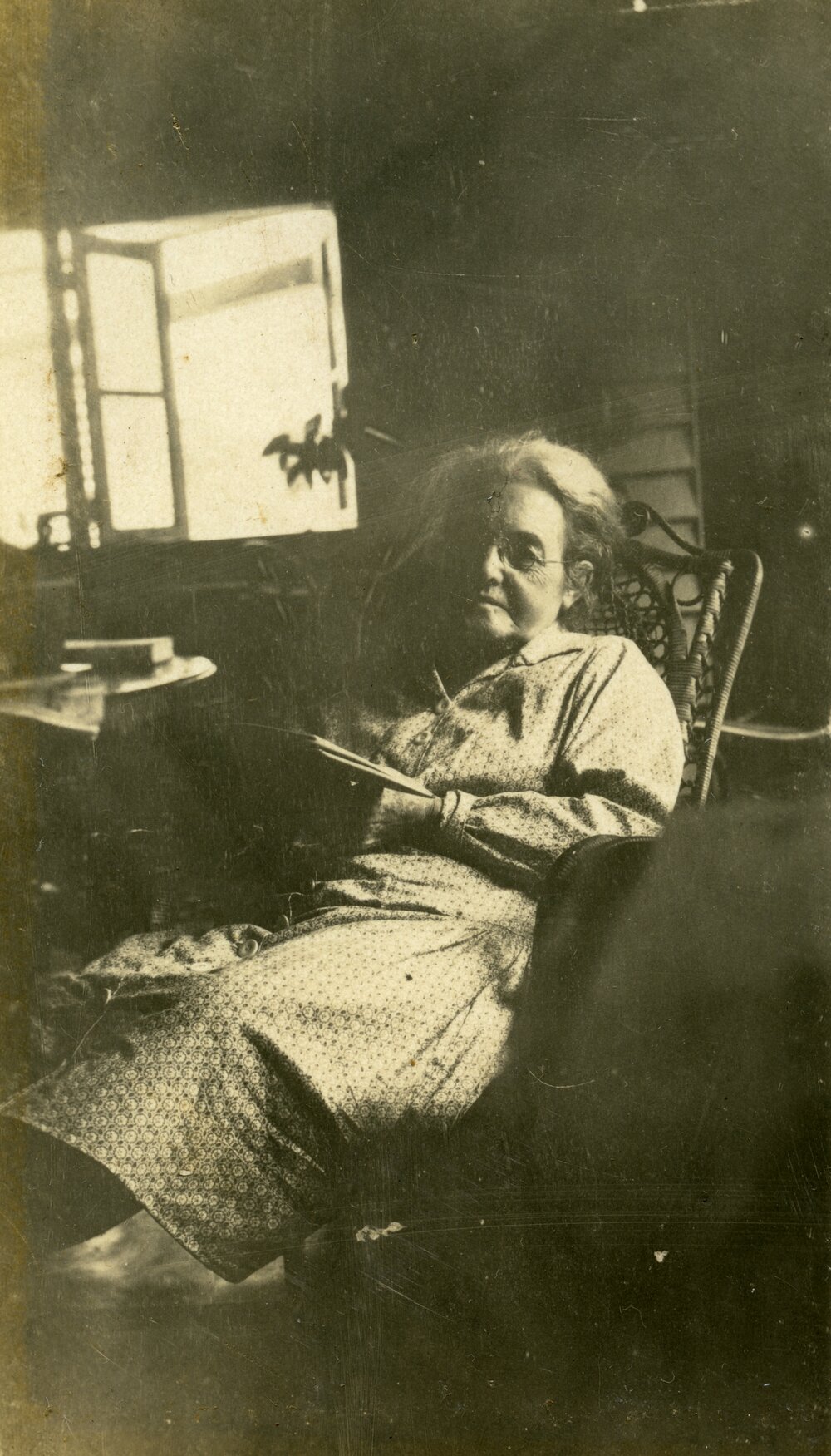 Elderly woman enjoying her book, ca 1920s