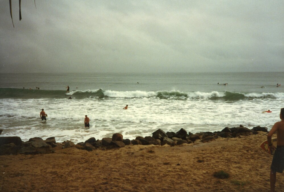 Stormy weather, big seas, surfing and swimmers, Noosa Main Beach, Noosa Heads, 1996