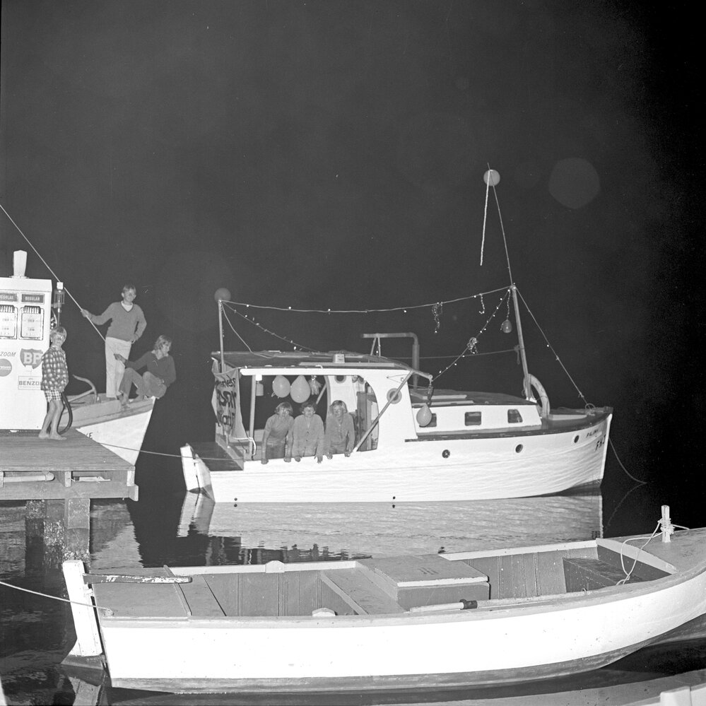Peter Saal, Mark Bisman and Jeffery Chase on board Paloma, best decorated boat, Festival of Waters, Noosa River, Noosaville, 2 September 1972