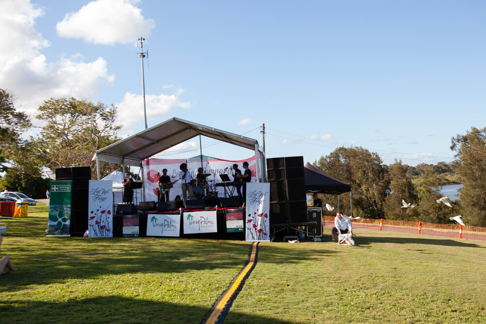Releasing the Doves of Peace, Peter O'Toole, White Doves of Noosa (bottom right), Kimberly Hodgson (left on stage), Lai Utovou (centre on stage) and Band Members, Remembrance Day, Looking Forward to Peace Event, Tewantin-Noosa RSL Memorial Park, Tewantin,
