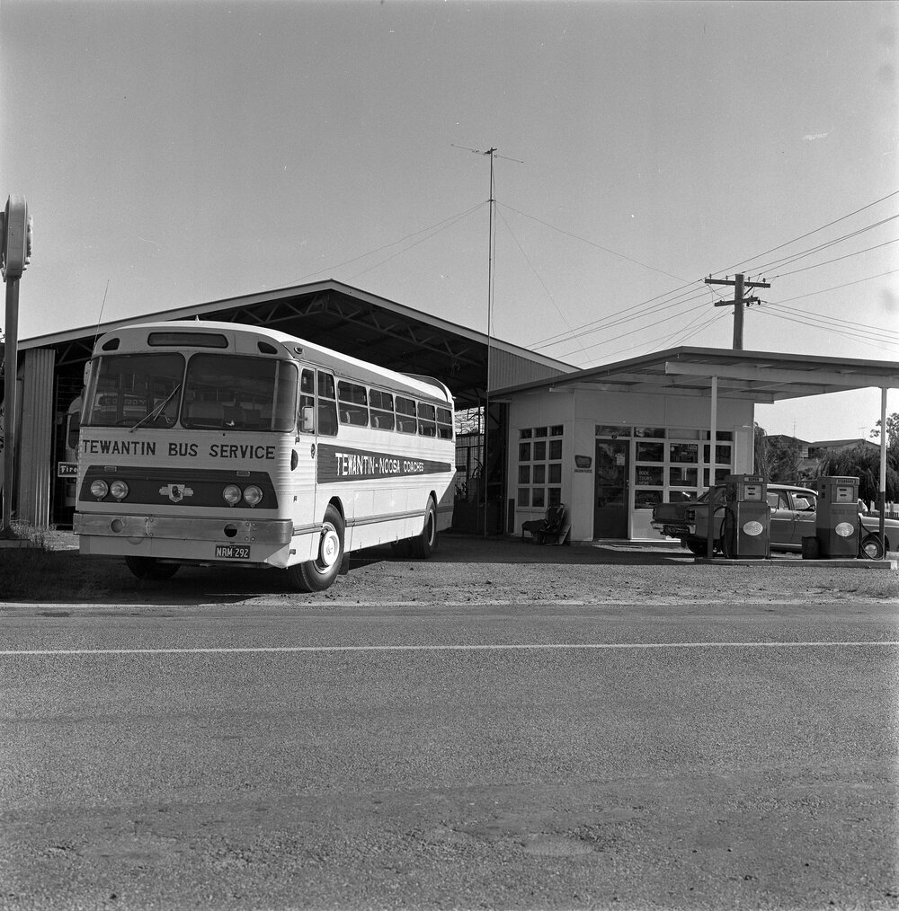 Bus, Tewantin-Noosa Coaches, Golden Fleece service station, Tewantin, March 1973
