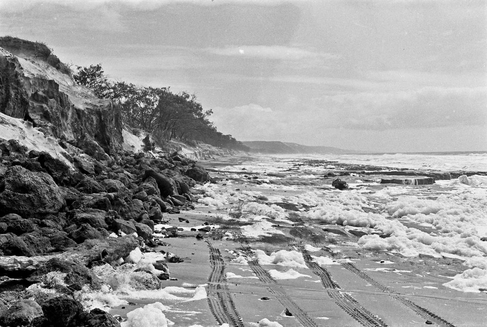 Storm surge and vehicle tracks, Sunshine Beach, ca 1970s