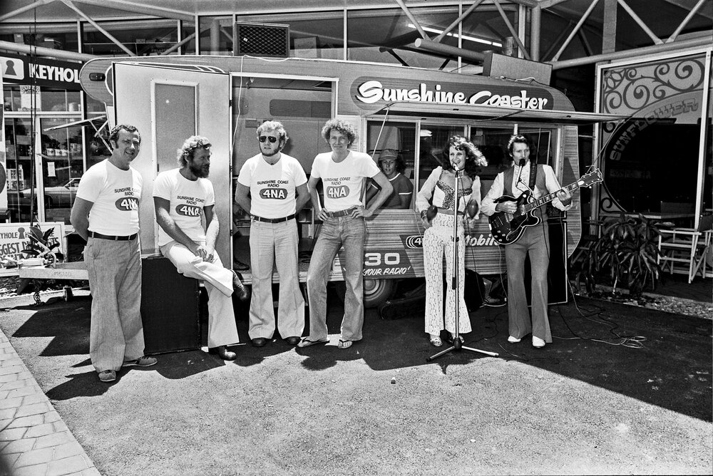 Radio station 4NA staff and musicians, official opening, Arcadia Shopping Centre, Sunshine Beach Road, Noosa Junction, Noosa Heads, 1970s