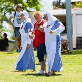 Carol Norris (red bib) and Marilla Murphy (far right) (l-r), Red Cross Volunteers, Remembrance Day, Looking Forward to Peace Event, Tewantin-Noosa RSL Memorial Park, Tewantin, 11 November 2021