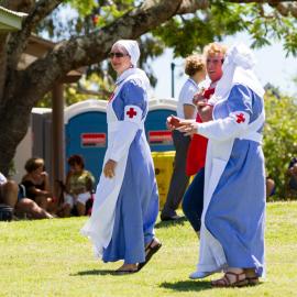 Carol Norris (red bib) and Marilla Murphy (far right) (l-r), Red Cross Volunteers, Remembrance Day, Looking Forward to Peace Event, Tewantin-Noosa RSL Memorial Park, Tewantin, 11 November 2021
