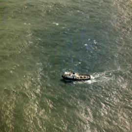 Aerial view, Tugboat, 'William R. Golding', waiting for salvage attempt, off Teewah Beach, Noosa North Shore, 7 July 1973