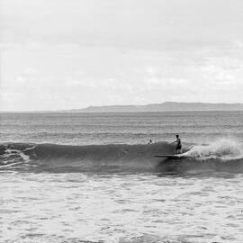Board riders, Cyclone Dinah, Noosa Main Beach, Noosa Heads, 29-30 January, 1970