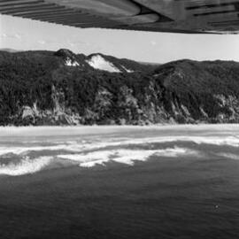 Aerial view of the beach along Noosa North Shore with Lake Cootharaba above, 1970