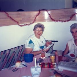 Fran Scholfield (QCWA) and Marcia Dorricott (QCWA Tewantin Noosa Branch- Branch Treasurer) (l-r), Christmas breakup, Queensland Country Women's Association, 1992