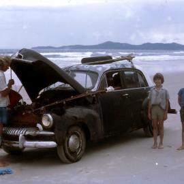 Car repairs, Kevin Burton, Brian and Stephen Riley, Teewah Beach, ca 1974
