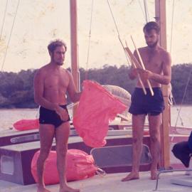 Checking the rig, sailors, Noosa River, 1970s