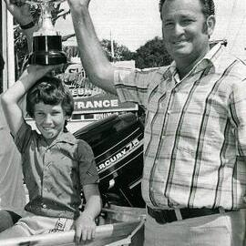 David (in boat) and Peter Riley, 1st prize winner, inaugural Fishing Competition, Noosaville, 1983