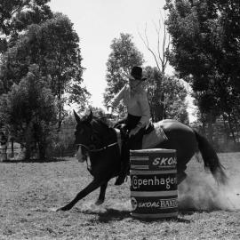 Competitor, Ladies barrel race, Pomona Rodeo, Pomona Showgrounds, Exhibition Street, Pomona, ca 1980s