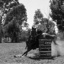 Competitor, Ladies barrel race, Pomona Rodeo, Pomona Showgrounds, Exhibition Street, Pomona, ca 1980s