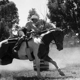 Competitor, Ladies barrel race, Pomona Rodeo, Pomona Showgrounds, Exhibition Street, Pomona, ca 1980s