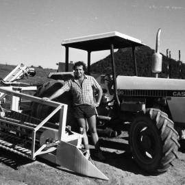 Farmer and machinery, Pomona, 1980s