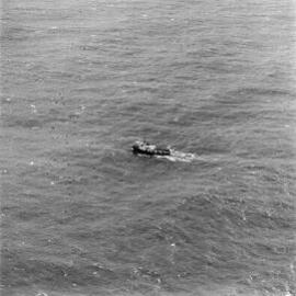 Aerial view, Tugboat, 'William R. Golding', waiting for salvage attempt, off Teewah Beach, Noosa North Shore, 7 July 1973