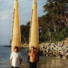 Peter Biden and Ken Lucas (l-r) with Bill Wallace crafted 16 foot 'Toothpick' surfboards, Noosa Main Beach, Noosa Heads, ca 1990s