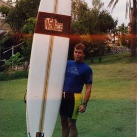 Peter Biden with Wallace surfboard, ca 1990s