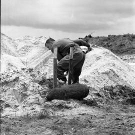 Digging for unexploded ordnance, Major David Luke, Sunshine Beach, November 1972
