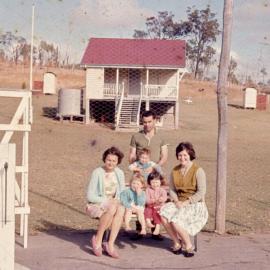 Daphne Jeffs (seated left), Fiona Jeffs (held by man) and friends, Gaeta State School, ca 1963