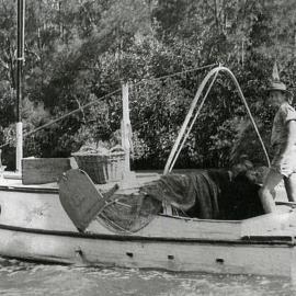 Kevin Clarey onboard 'Victory', Noosa River, 1961