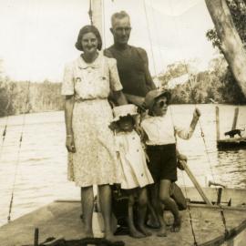 Nell, John (adults), Shirley and Kevin Clarey, 'Restdown' landing, Lake Cooroibah, 1946