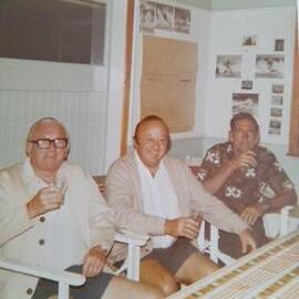 Reg Jones, Bernard Dowd, friend of Bernard (r-l), boatshed, Gympie Terrace, Noosa River, Noosaville, ca 1960s