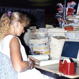 Nicole Hunt covering books, Noosa Libraries, Pelican Street, Tewantin, ca 1990s