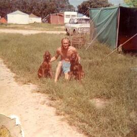 Dennis Lewis with Hylee and Summer (dogs), 'The Woods' camping area, Noosa Heads, 1973