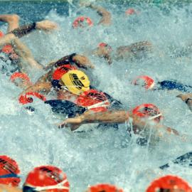 Competitors, swim leg, Noosa Triathlon, Noosa Heads, 1980s