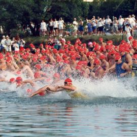Competitors, swim leg, Noosa Triathlon, Noosa Heads, 1980s