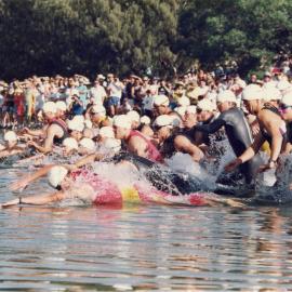 Competitors, swim leg, Noosa Triathlon, Noosa Heads, 1980s