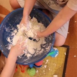 Children mixing dough, Noosa Libraries storytime activity, ca 2023