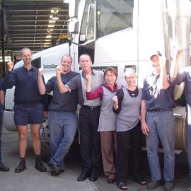 Noosa Council fleet staff and mobile library operators celebrating getting their heavy-combination driver's license, Noosa Council Depot, Noosaville, 22 August 2005